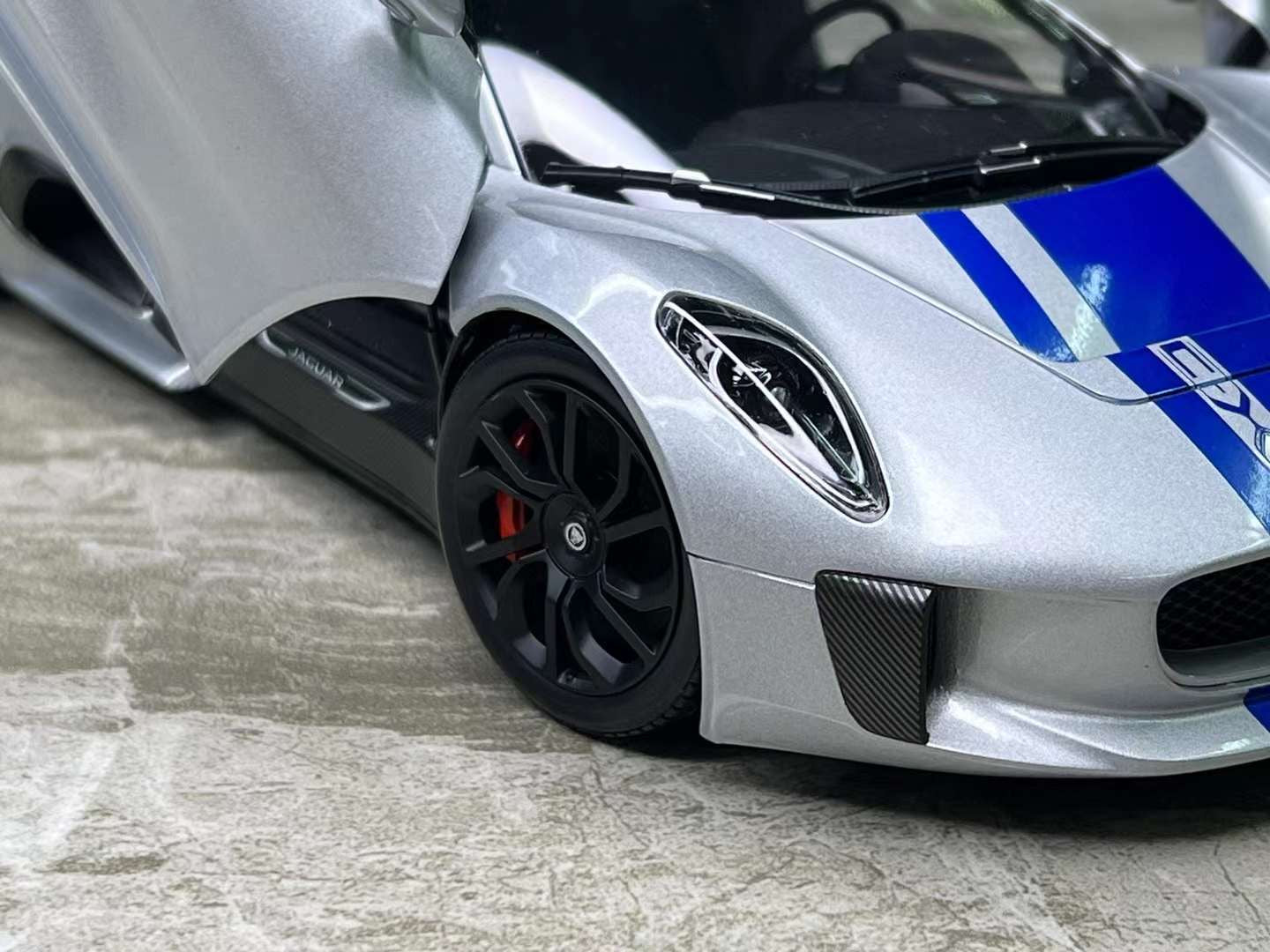Almost Real Jaguar CX-75 1/18 (Lightning Silver/ Blue Stripes)